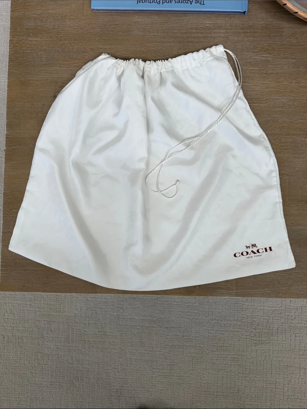 Coach 23” x 19” satin dust bag in white with brown lettering, GUC